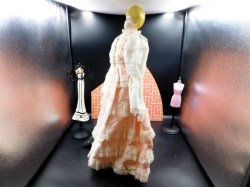 20 inch blonde porcelain pink doll side a